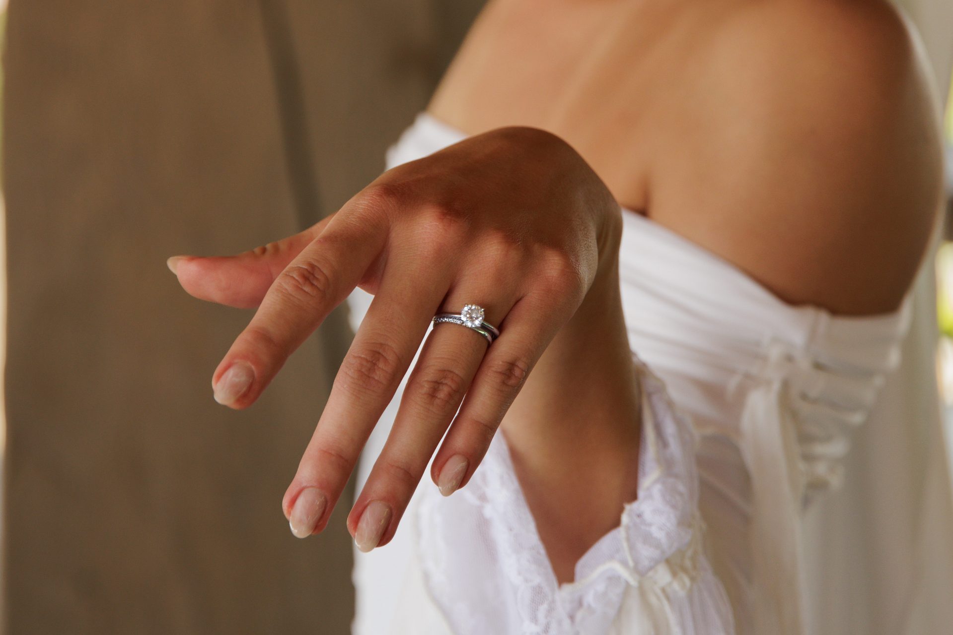 Close-up of bride showing her engagement ring