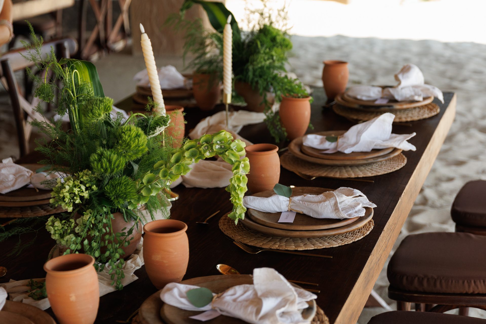 Full reception table beautifully set at sunset